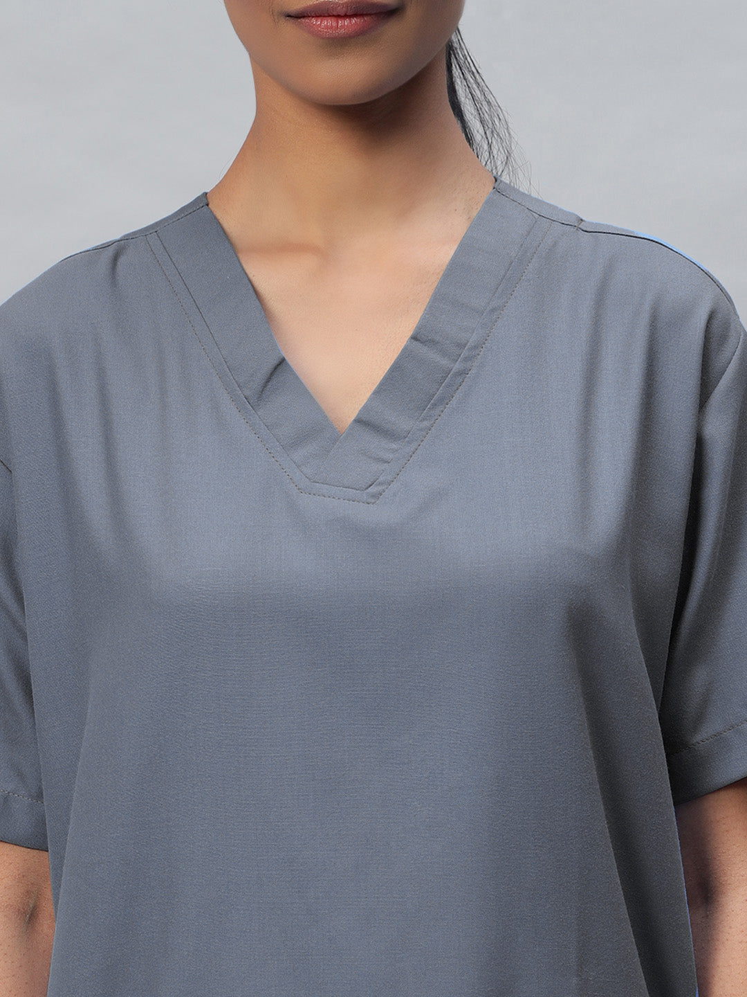 side look of medical scrub for women in dark grey color