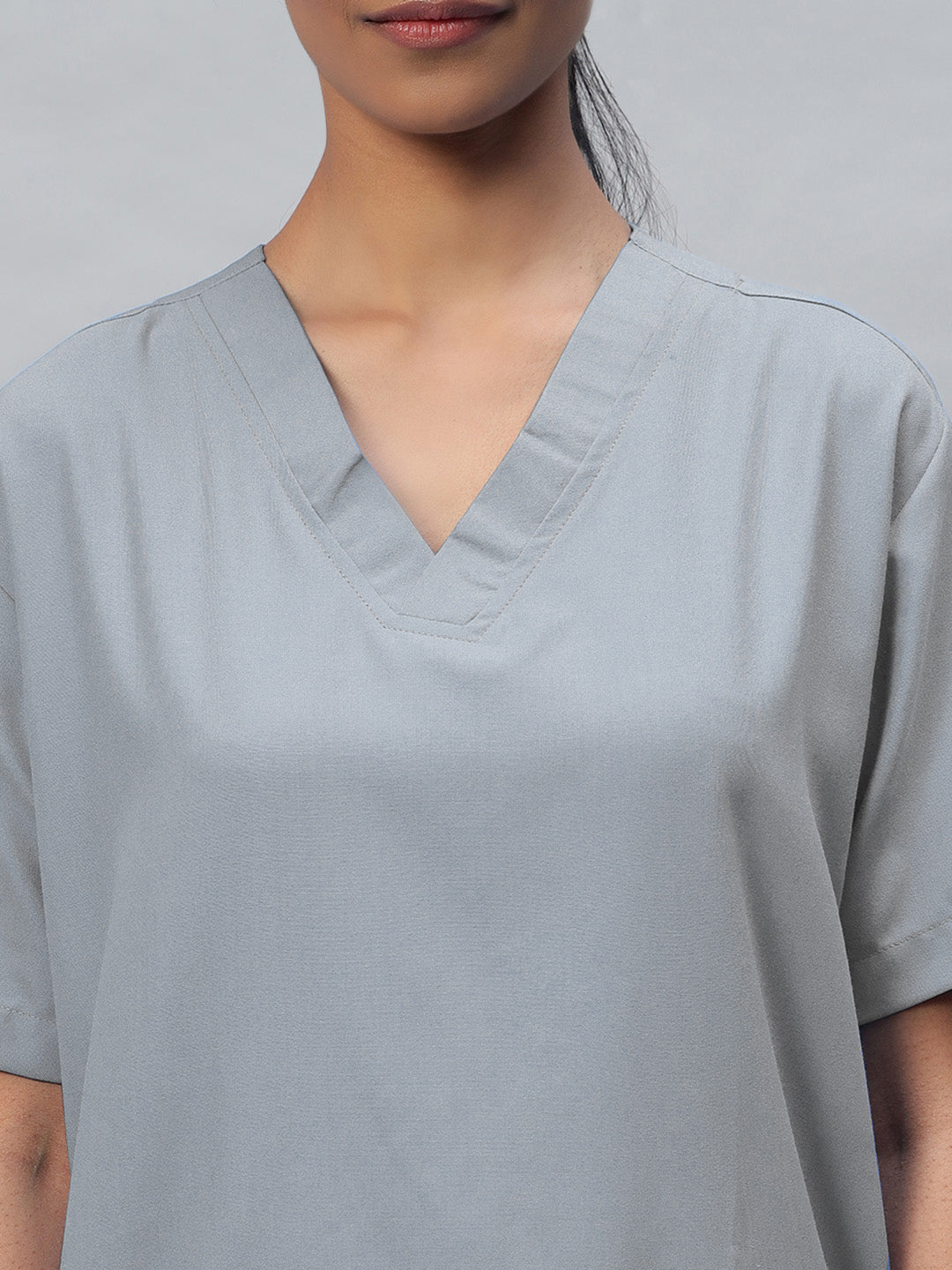 zoomed look of grey medical scrub for women