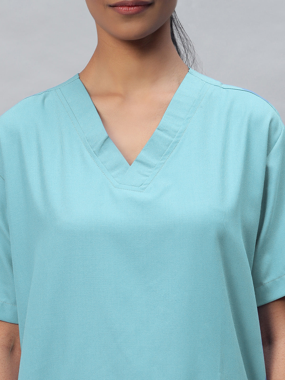 zoomed look of v neck sea blue top for women