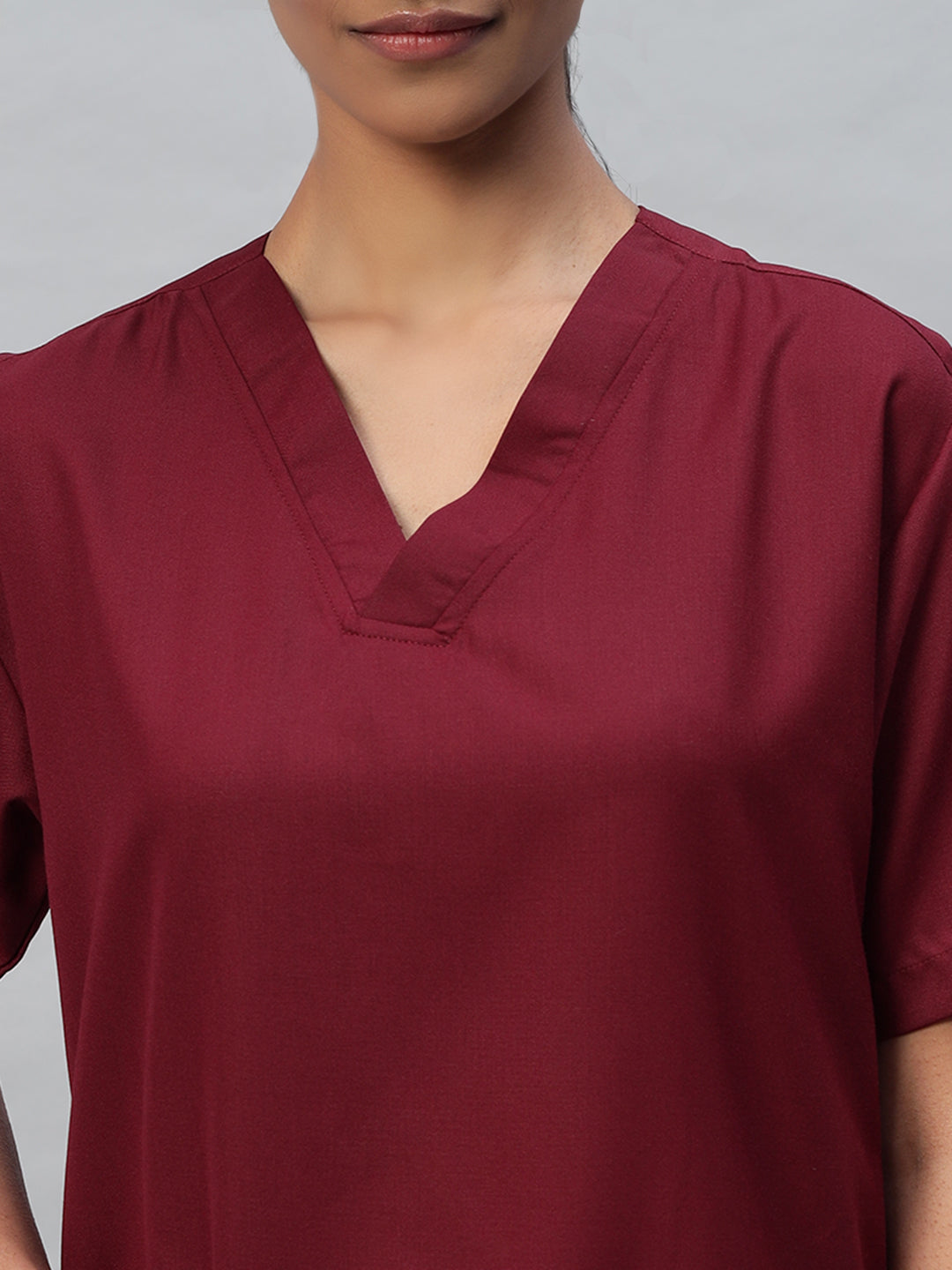 side look of Maroon color medical scrub for women