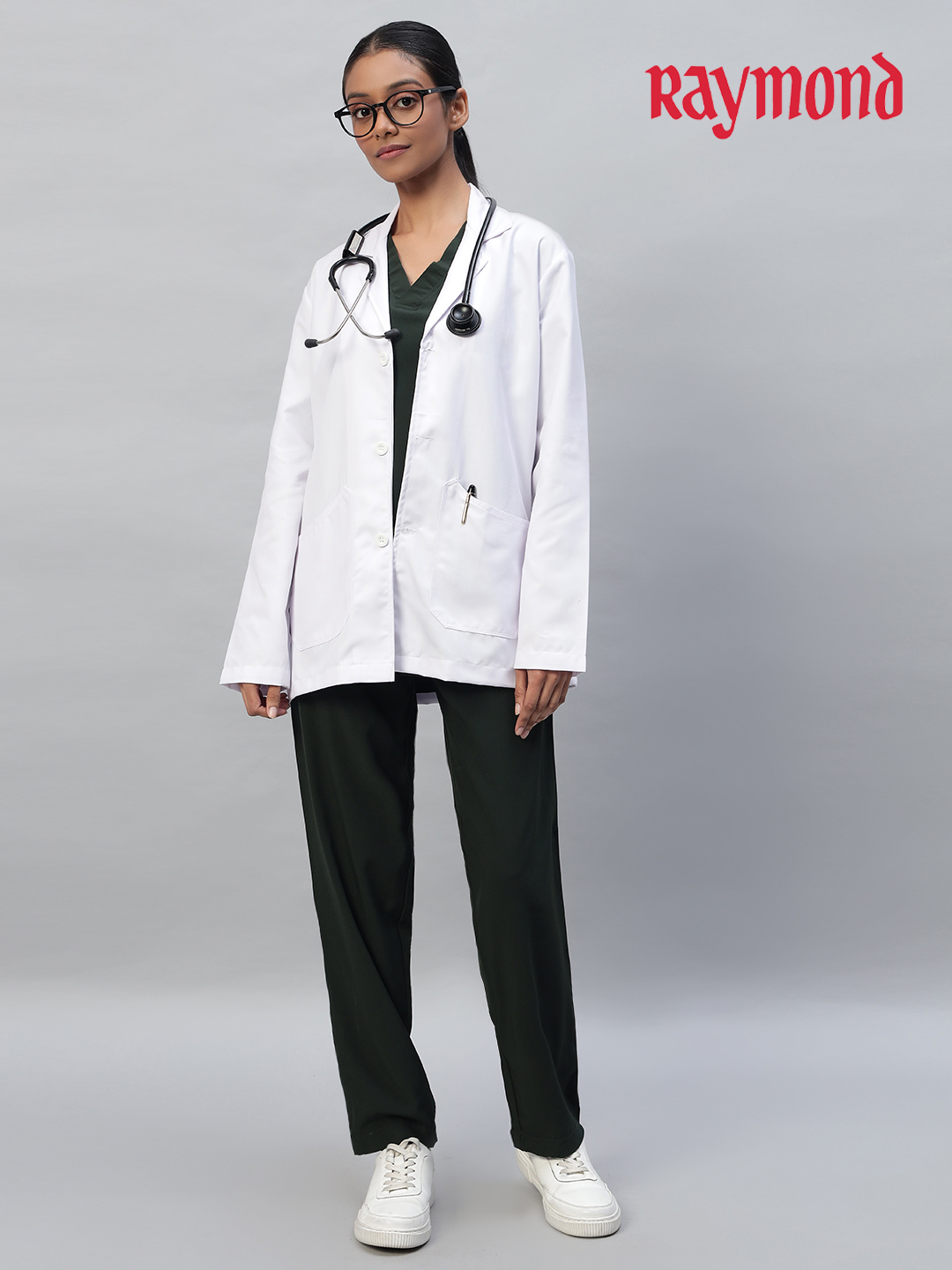 A person wearing a white full-sleeve lab coat with large pockets, suitable for medical professionals.