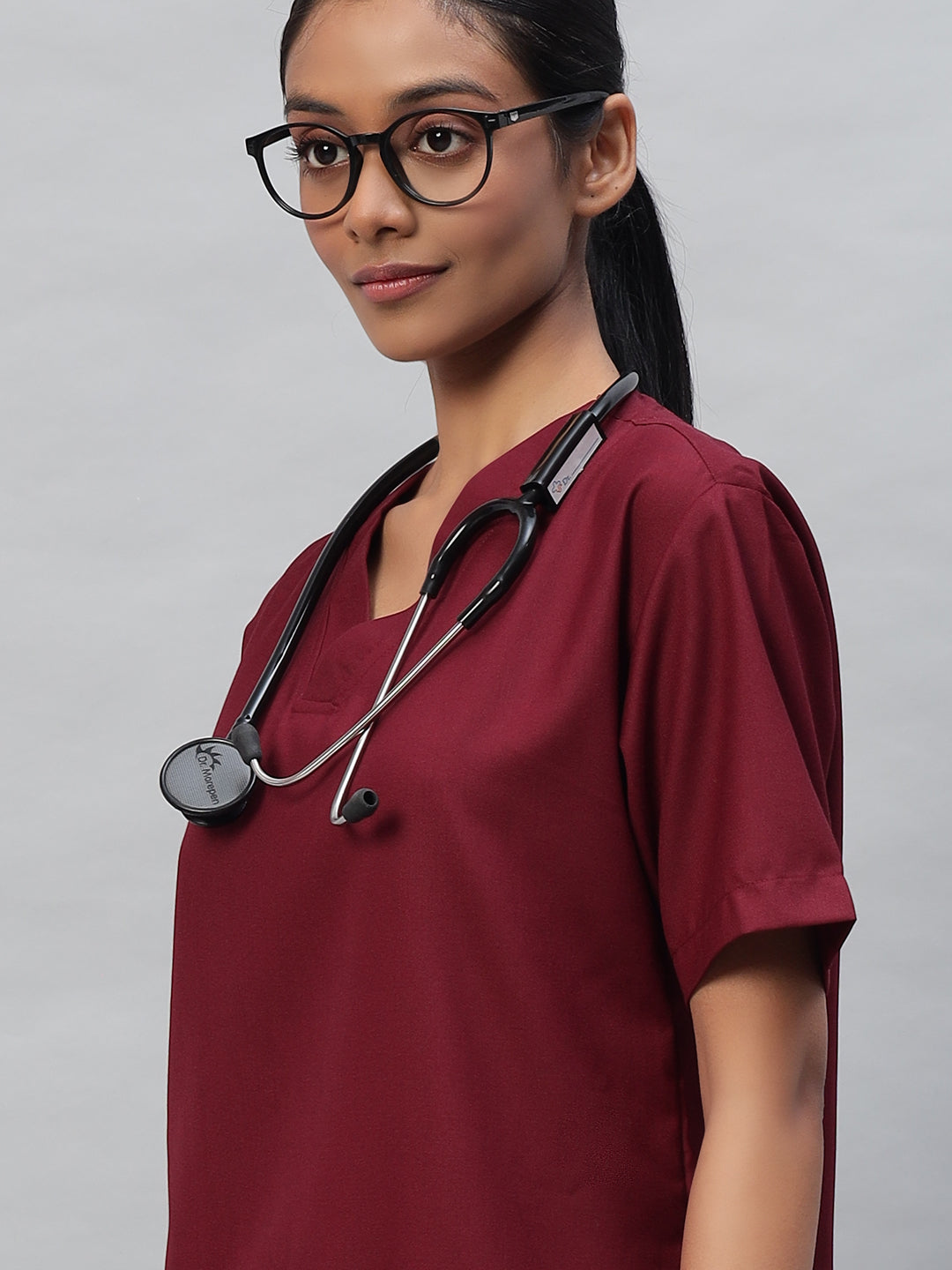 close look of maroon medical scrub for women