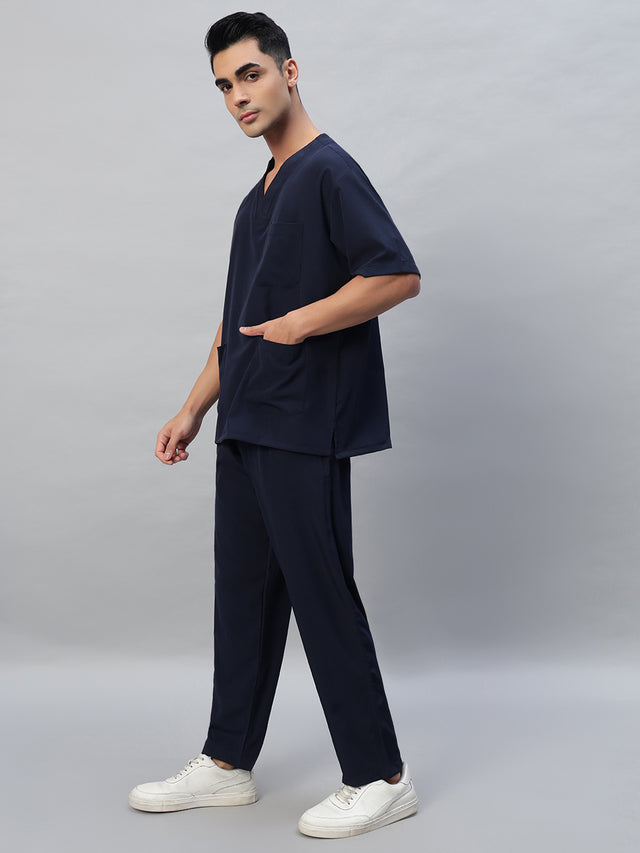 Navy blue V-neck, half sleeve medical scrub top with a front pocket and matching scrub pants