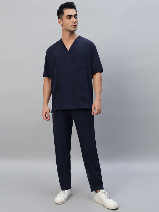 Navy blue V-neck, half sleeve medical scrub top with a front pocket and matching scrub pants
