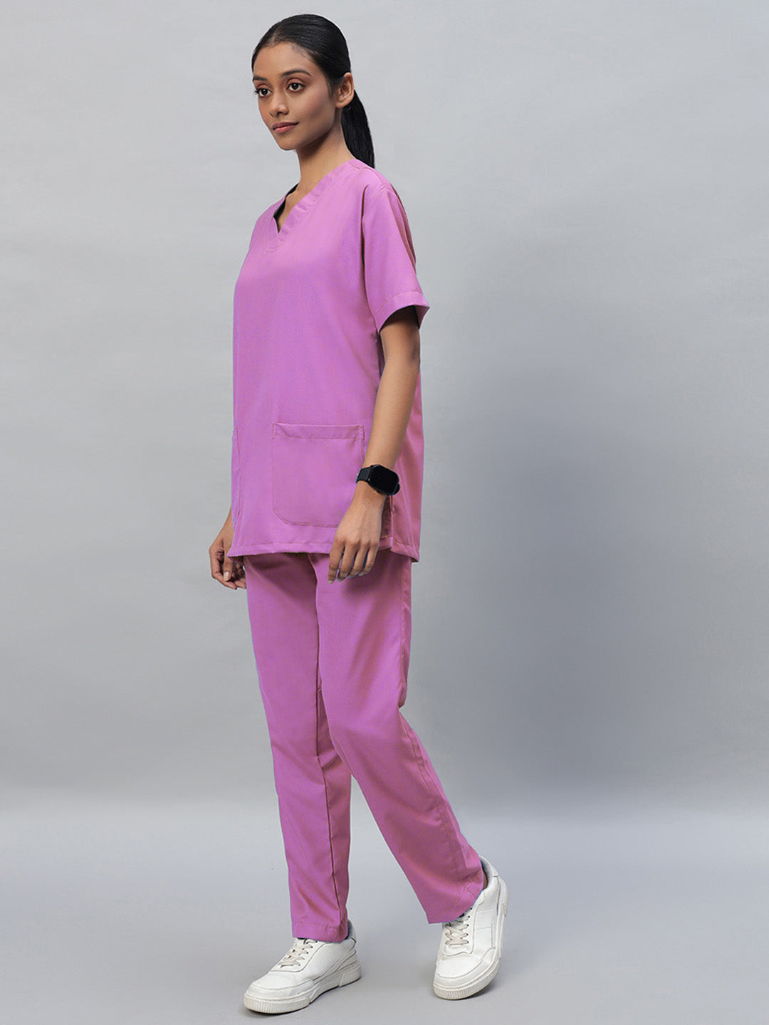 pink half sleeve medical scrubs with a V-neck top and a front pocket, paired with full elastic pants with drawstrings.