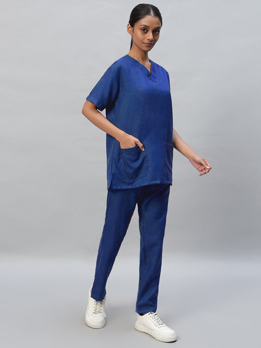 royal blue medical scrub set with half sleeves and a V-neck, consisting of a top and pants with drawstrings.